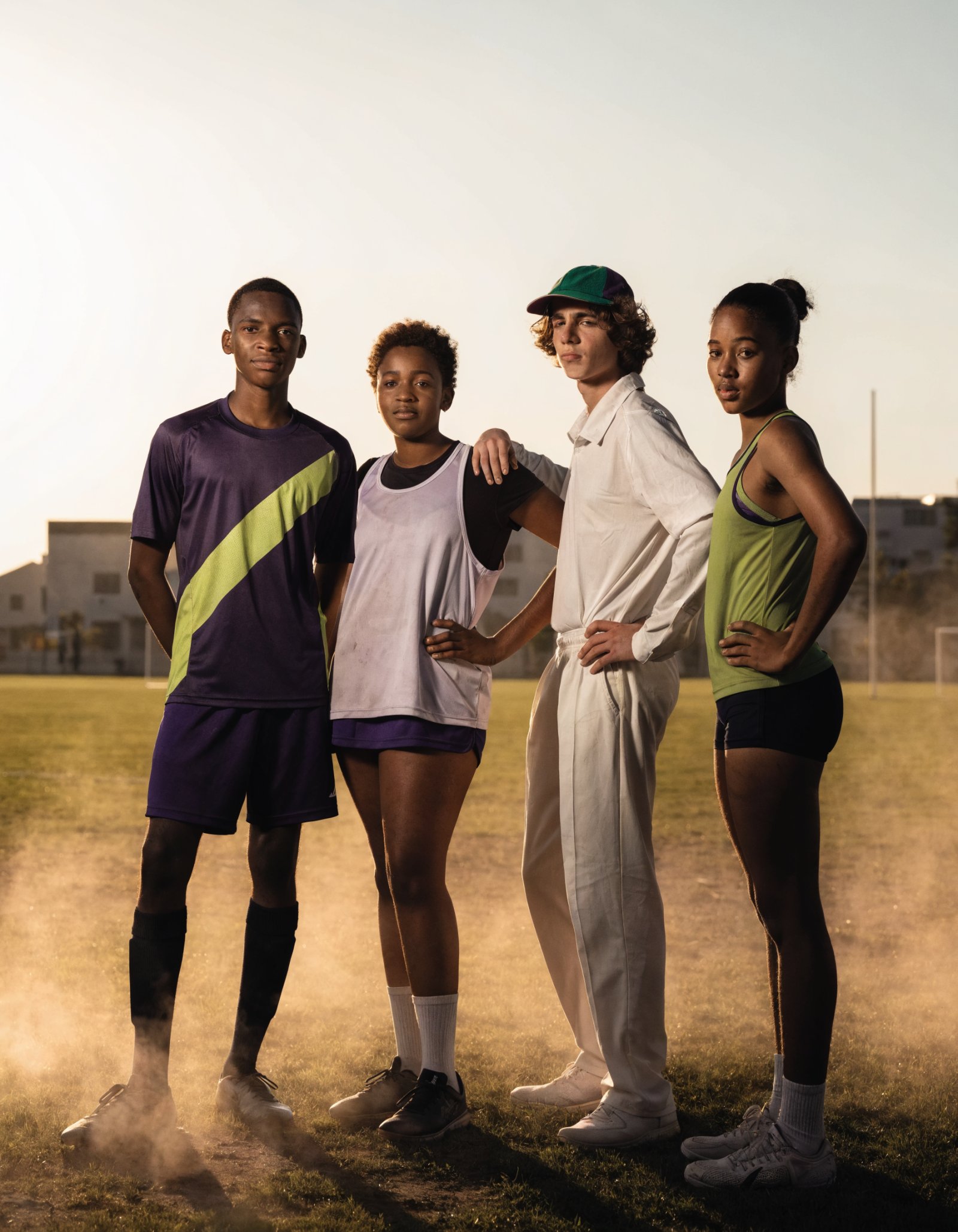 Diverse South African youth athletes from multiple sports at golden hour